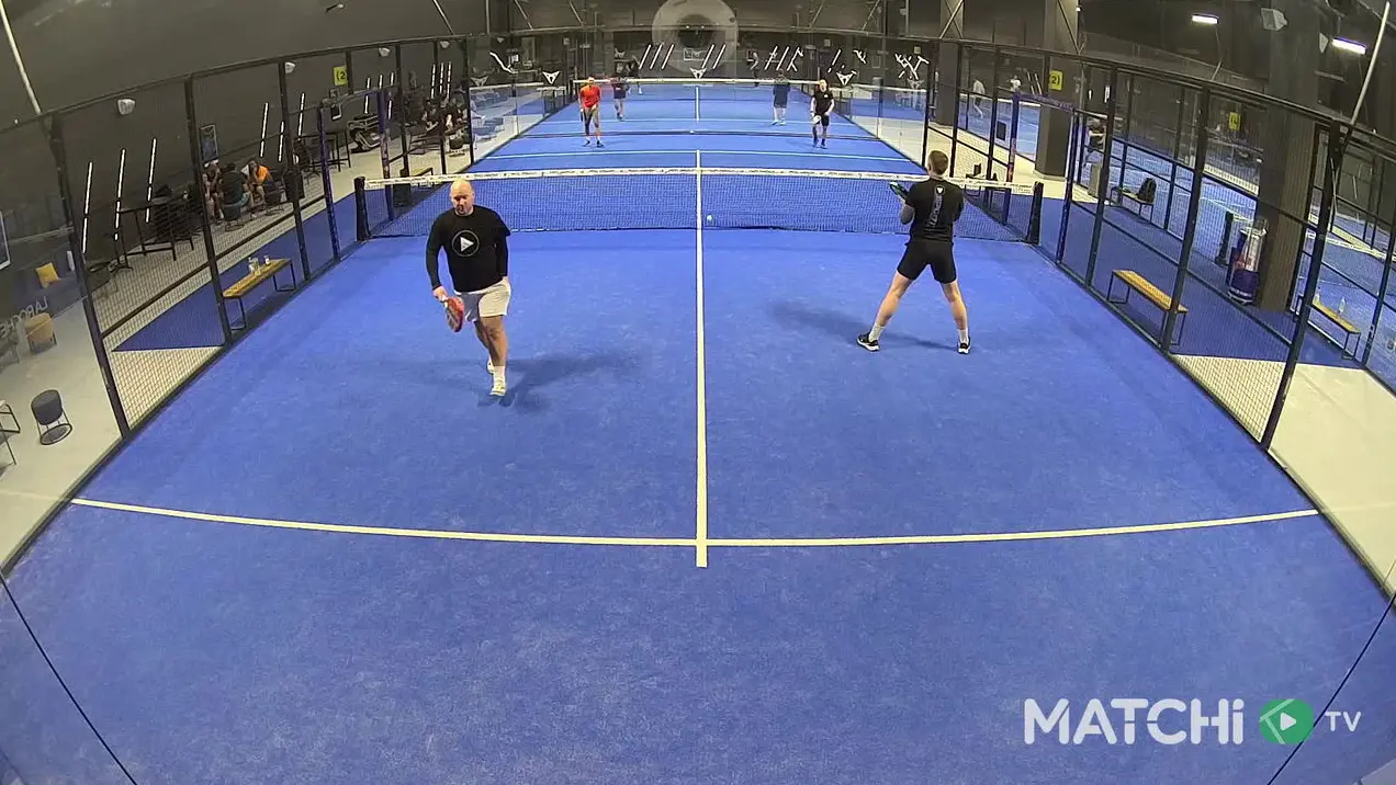 Padel players practicing with AI analysis overlay on a blue court